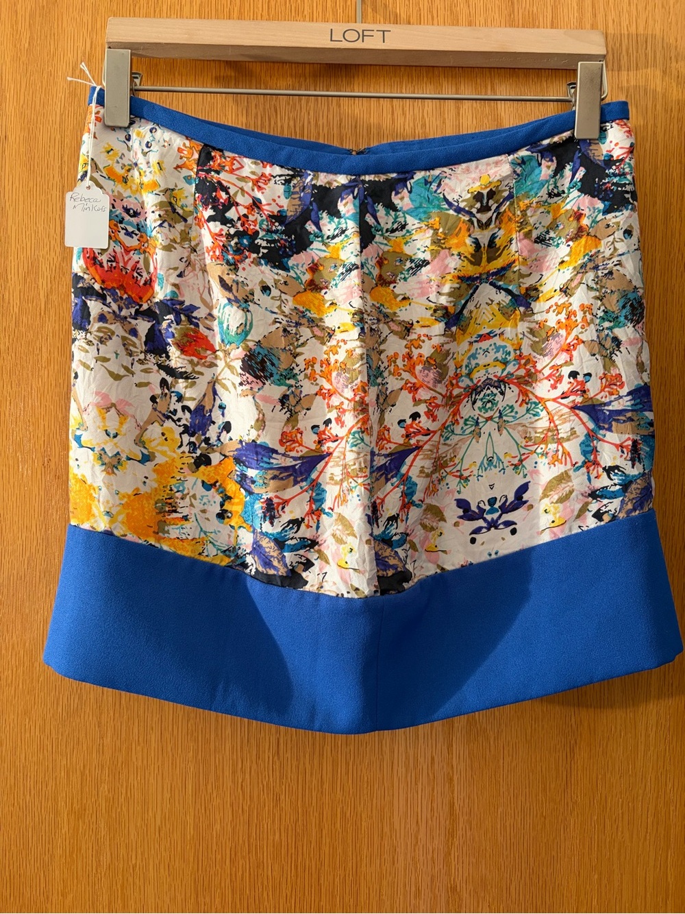 #933 Rebecca Minkoff Multicolor Floral Mini Skirt with Royal Blue Hem.